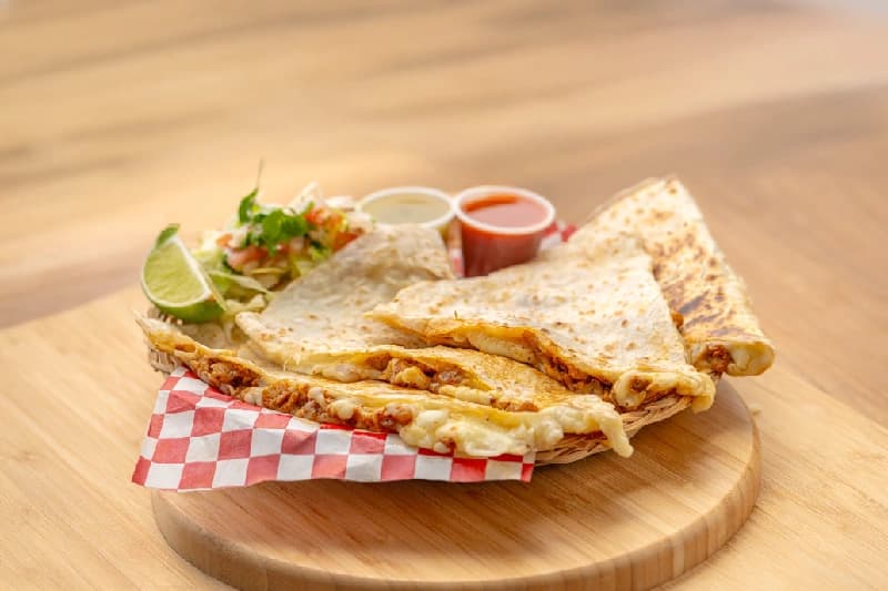 Fresh quesadillas with flour tortillas and melted cheese